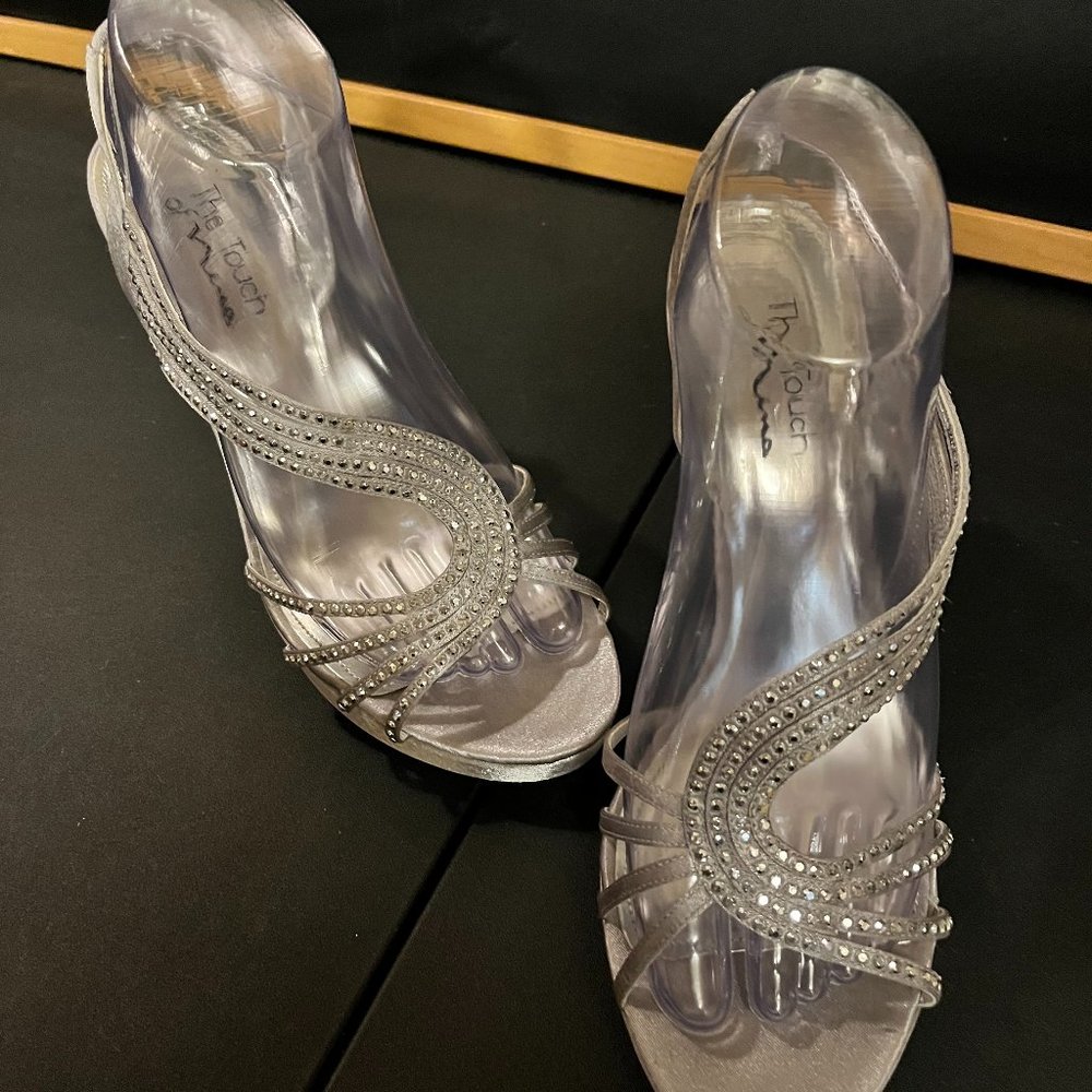 Closer to the Megan style. Very elegant. Covered with white gems.